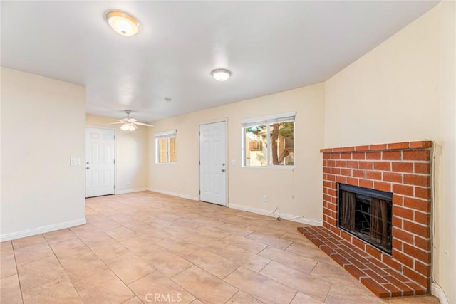 unfurnished living room featuring light tile patterned floors, a fireplace, and ceiling fan