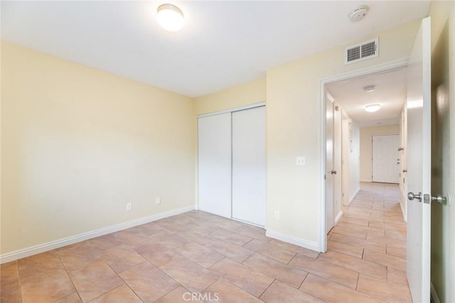 unfurnished bedroom featuring a closet