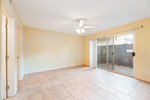 spare room featuring ceiling fan and light tile patterned flooring