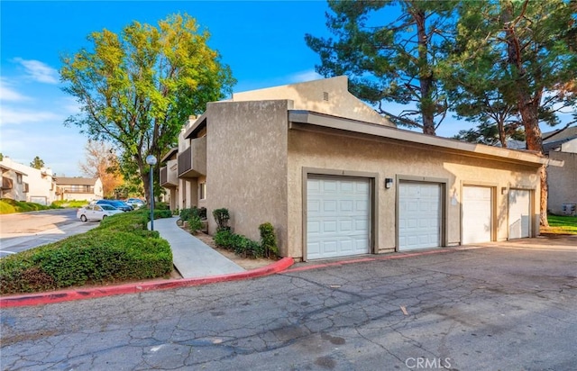 view of property exterior featuring a garage