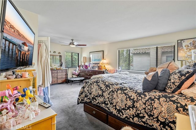 bedroom with dark carpet and ceiling fan