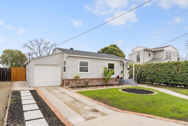 view of front of home with a garage and a front yard