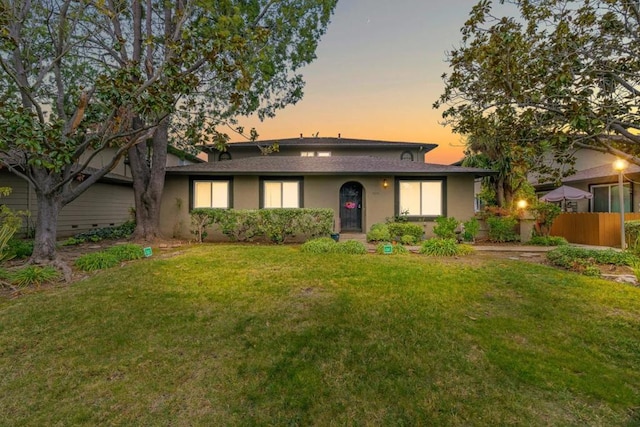 view of front of property with a lawn