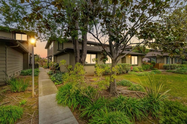 view of front of house with a yard