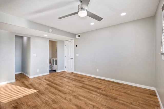 unfurnished room featuring hardwood / wood-style floors and ceiling fan