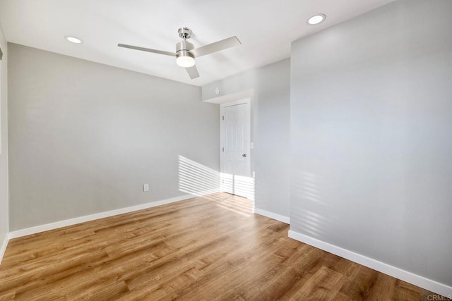 unfurnished room with wood-type flooring and ceiling fan