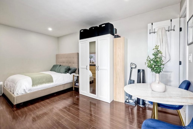 bedroom featuring dark hardwood / wood-style floors