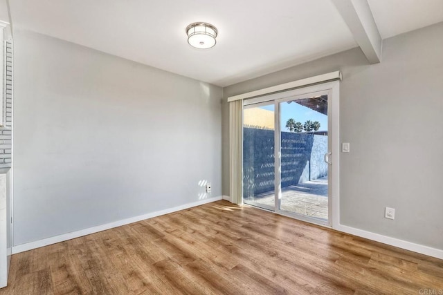 unfurnished room featuring hardwood / wood-style floors