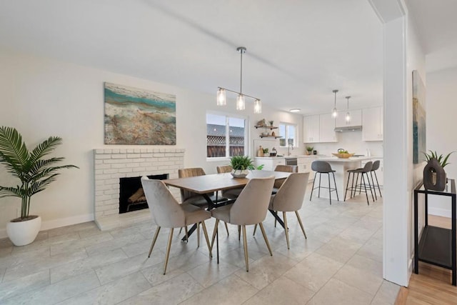 dining room featuring a fireplace