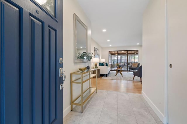 foyer entrance featuring light tile patterned floors