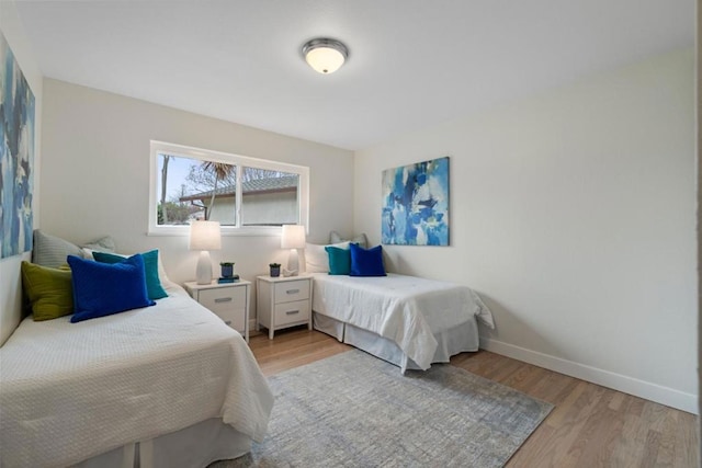 bedroom with light wood-type flooring