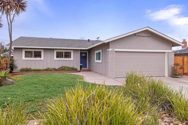 single story home with a garage and a front lawn