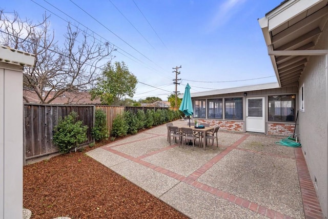 view of patio / terrace with a sunroom