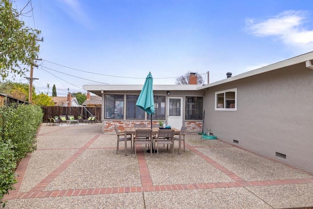 view of patio with a sunroom