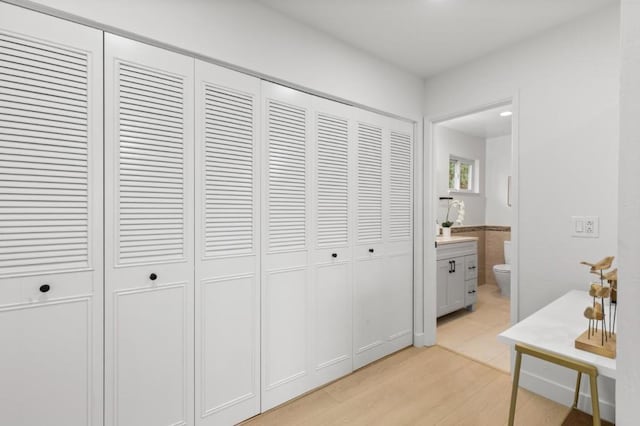 hallway with light hardwood / wood-style flooring