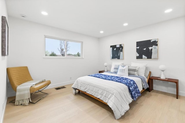 bedroom with light hardwood / wood-style flooring