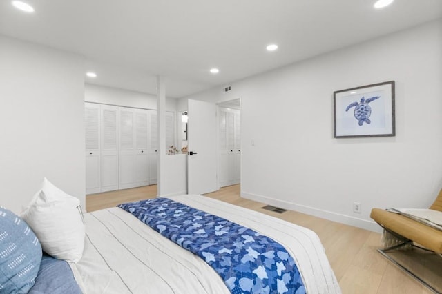 bedroom featuring a closet and light wood-type flooring