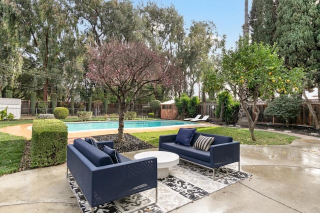 view of patio / terrace featuring a fenced in pool and outdoor lounge area