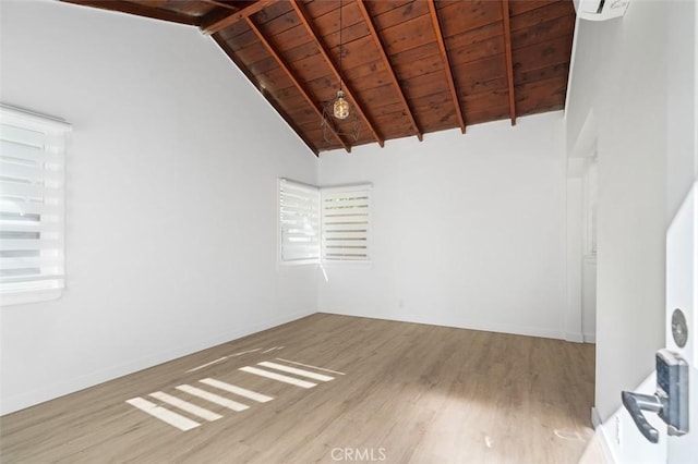 unfurnished room with beamed ceiling, high vaulted ceiling, light hardwood / wood-style floors, and wooden ceiling