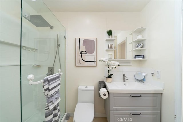 bathroom featuring vanity, backsplash, toilet, and walk in shower