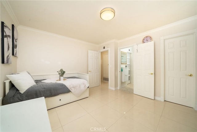 bedroom featuring ornamental molding and light tile patterned floors