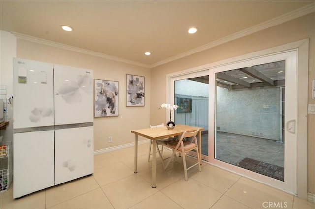 tiled dining area featuring ornamental molding