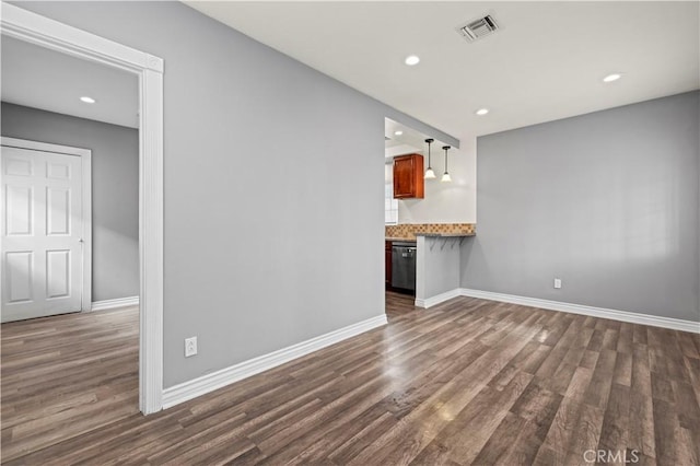 unfurnished living room with dark hardwood / wood-style flooring