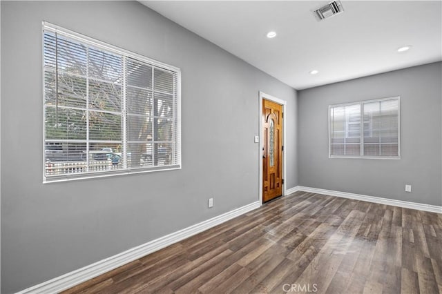 unfurnished room with hardwood / wood-style floors