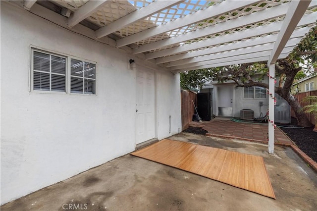 view of patio with central AC unit and a pergola