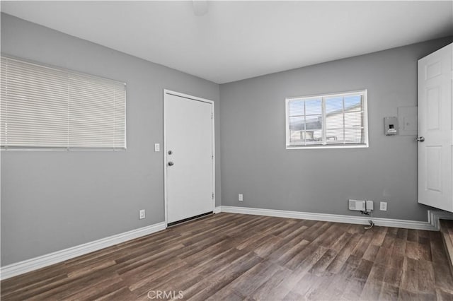 spare room featuring dark hardwood / wood-style floors