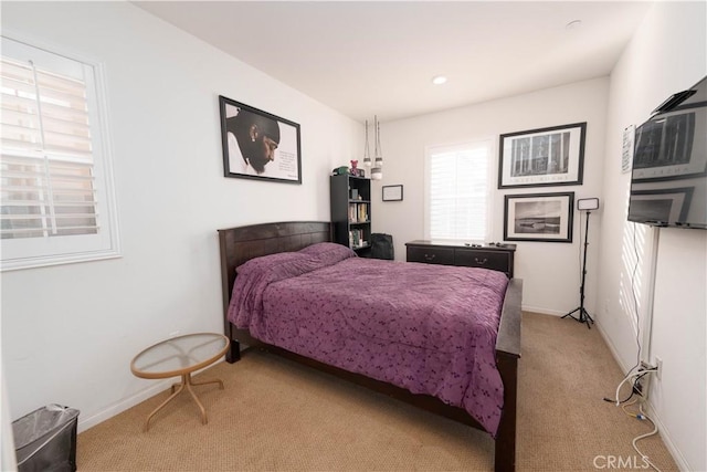 bedroom with light colored carpet