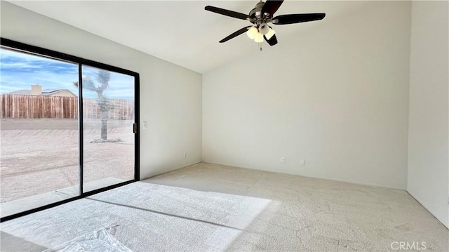 unfurnished room with vaulted ceiling and light colored carpet