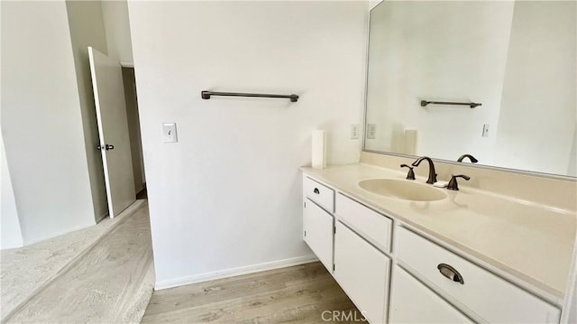 bathroom featuring vanity and wood-type flooring