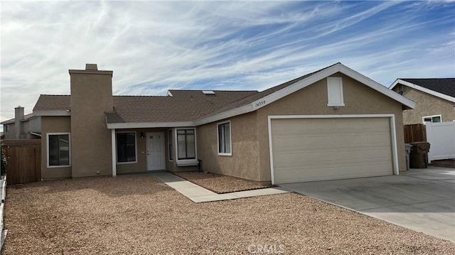 single story home featuring a garage