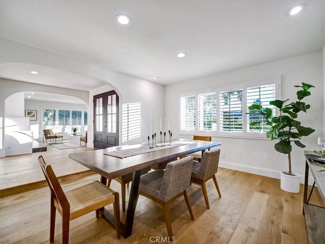 dining space featuring light wood-type flooring