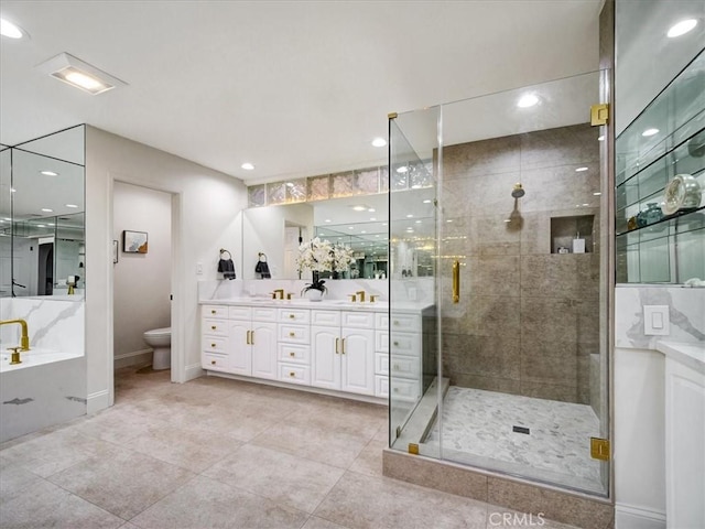 full bathroom featuring vanity, tile patterned floors, independent shower and bath, and toilet