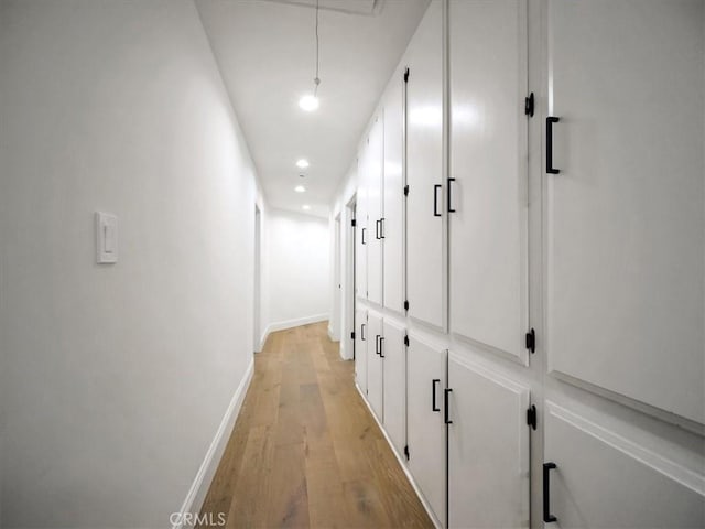 corridor with light wood-type flooring