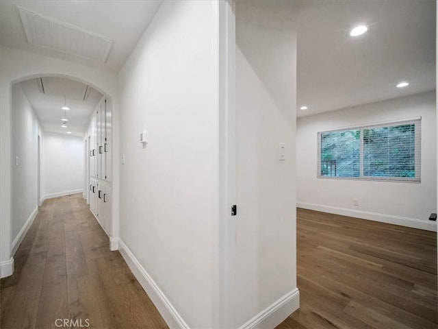 hallway featuring dark hardwood / wood-style flooring