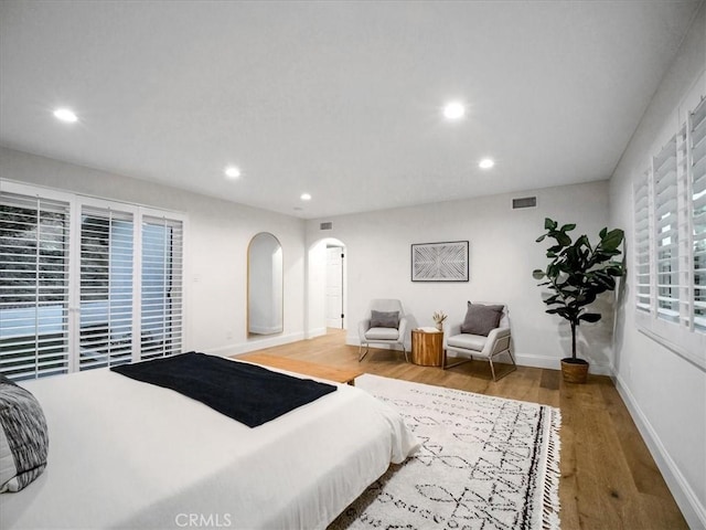 bedroom with hardwood / wood-style floors