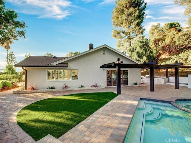 back of house with a yard and a patio area