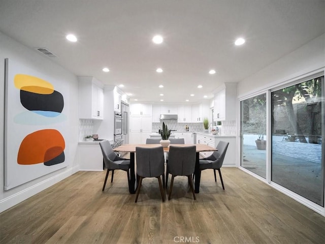 dining room featuring dark wood-type flooring