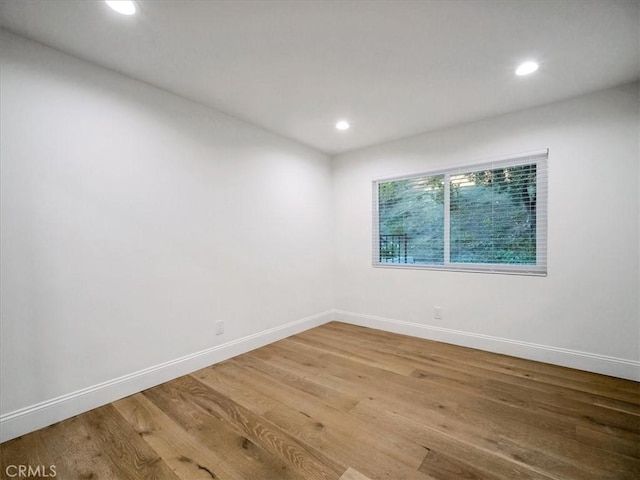 empty room with wood-type flooring