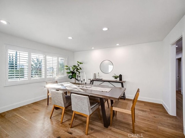 dining area with wood-type flooring