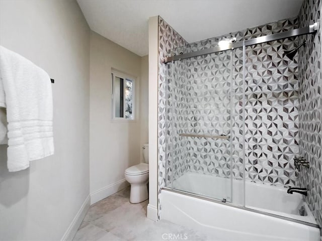 bathroom featuring enclosed tub / shower combo and toilet