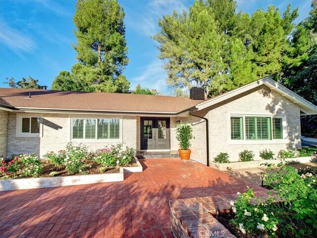 ranch-style house with a patio