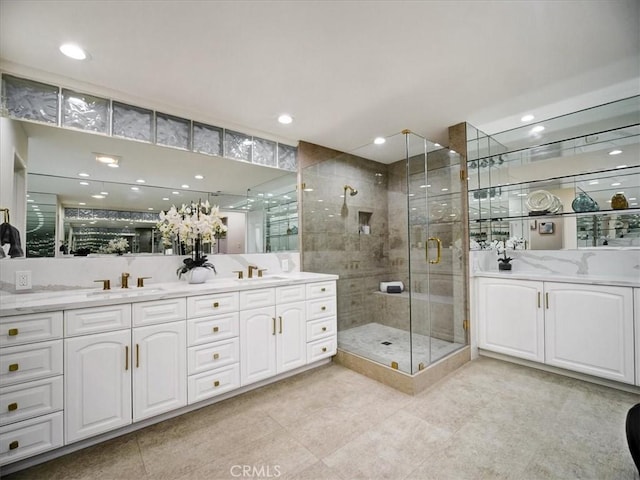 bathroom with vanity, tile patterned floors, and walk in shower