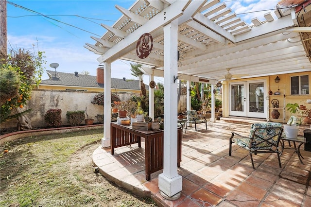 view of patio with french doors and a pergola