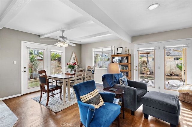 dining area with beamed ceiling, dark hardwood / wood-style flooring, and french doors