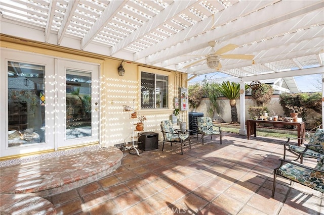 view of patio with french doors, ceiling fan, and a pergola