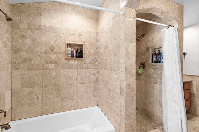 bathroom with shower / bath combo with shower curtain